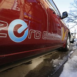 An electric car is charged on Main Street in Salt Lake City on Wednesday, Feb. 28, 2018. A transportation funding bill being considered by Utah lawmakers would hike registration fees for electric vehicles to $122 and plug-in hybrids to $52.
