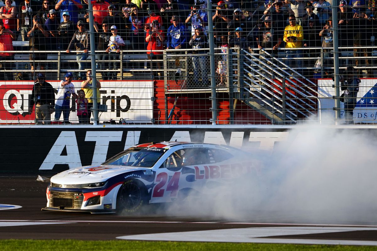 NASCAR Cup Series driver William Byron (24) performs a burnout as he celebrates winning the Folds of Honor QuikTrip 500 at Atlanta Motor Speedway.