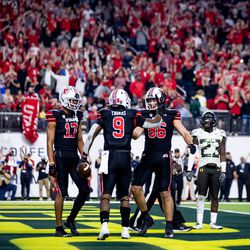 Utah Utes running back Tavion Thomas (9) celebrates with wide receiver Devaughn Vele (17) and tight end Dalton Kincaid (86) after Thomas ran for a touchdown during the Pac-12 championship game against the Oregon Ducks at Allegiant Stadium in Las Vegas on Friday, Dec. 3, 2021.