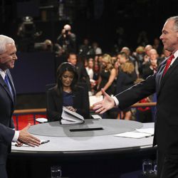 Republican vice-presidential nominee Gov. Mike Pence and Democratic vice-presidential nominee Sen. Tim Kaine, right, shake hands after the vice-presidential debate at Longwood University in Farmville, Va., Tuesday, Oct. 4, 2016. (Joe Raedle/Pool via AP)