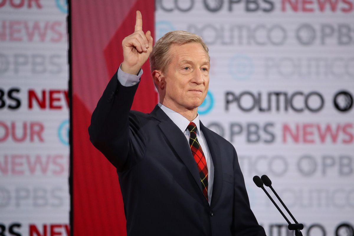Tom Steyer raises a hand during the sixth Democratic debate in Los Angeles
