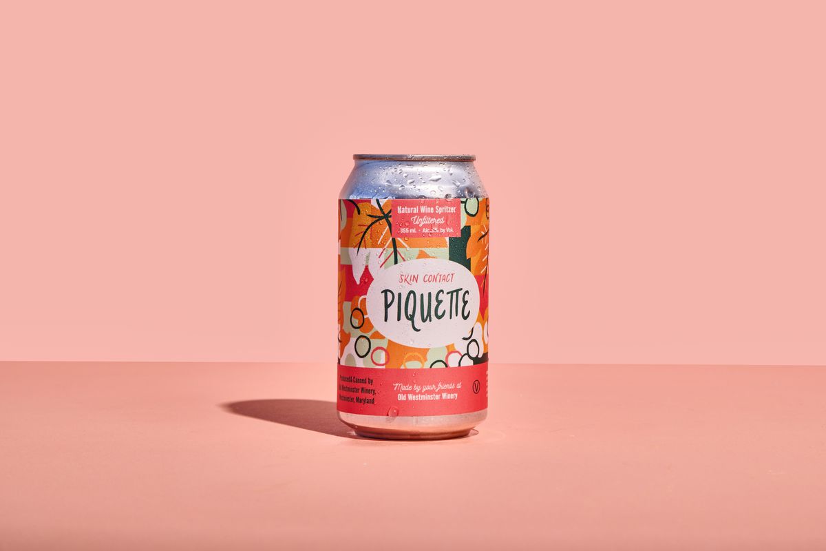 Aluminum can with pink floral label reading “Piquette.”