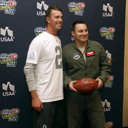NFL Pro Bowler Matt Ryan poses with an Air Force Capt. Evan Schonour during the Airman for a Day event sponsored by USAA, the Official Military Appreciation Sponsor of the NFL on Wednesday, January 21, 2015 in Glendale, Arizona. 