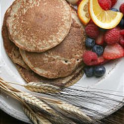 You don't need a wheat grinder to make whole-wheat pancakes, left. Just soften the wheat by soaking it in water and let the blender do the rest.