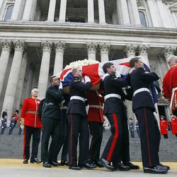 Former British Prime Minister Margaret Thatcher's coffin is carried by pallbearers out from St Paul's Cathedral, following the ceremonial funeral service in London, Wednesday, April 17, 2013. Thatcher, who died, at the age of 87 on 8 April, has been accorded a ceremonial funeral with military honours, one step down from a state funeral, Thatcher was elected Prime Minister on May 4, 1979 and she resigned on Nov. 28, 1990, after eleven years in office.