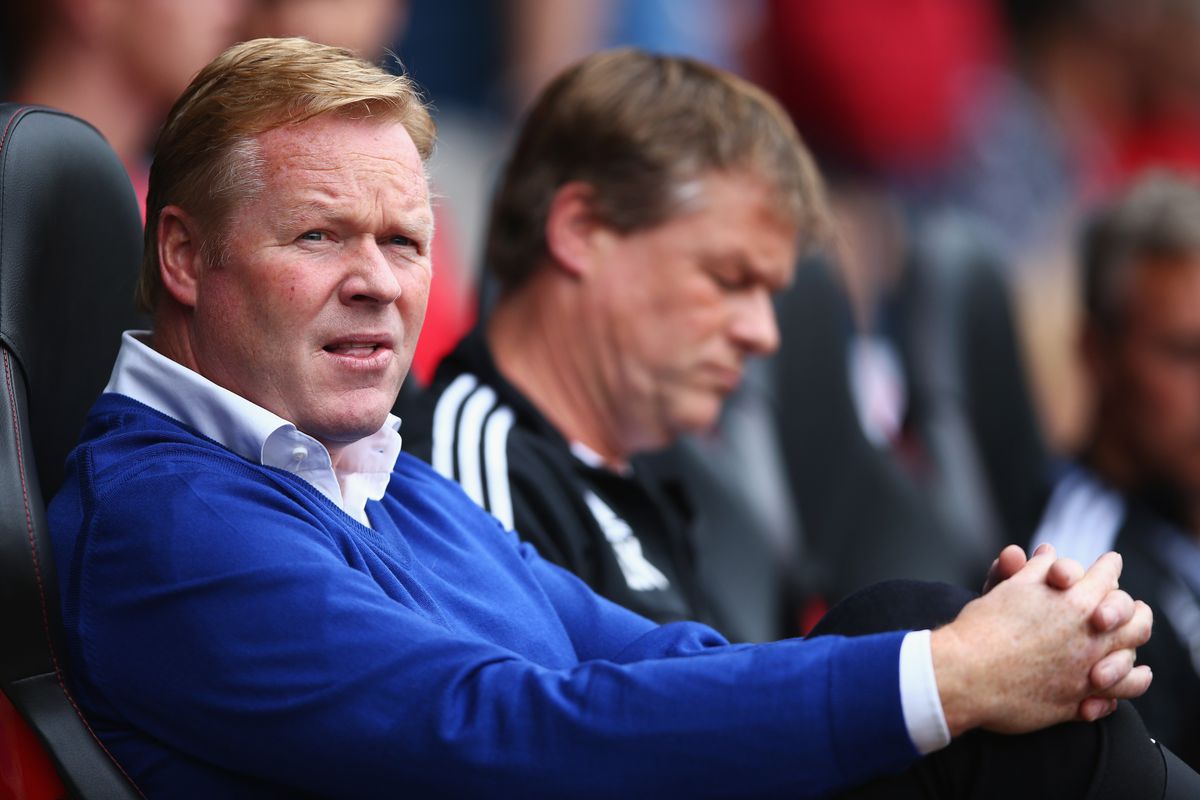 Ronald Koeman, front, watches his Saints team from the bench with his brother, Erwin.