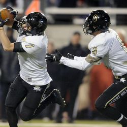 Desert Hills' Landen Broadhead makes an interception in front of teammate Braden Reber during the 3AA State Championships at Rice-Eccles Stadium on Friday, November 22, 2013.