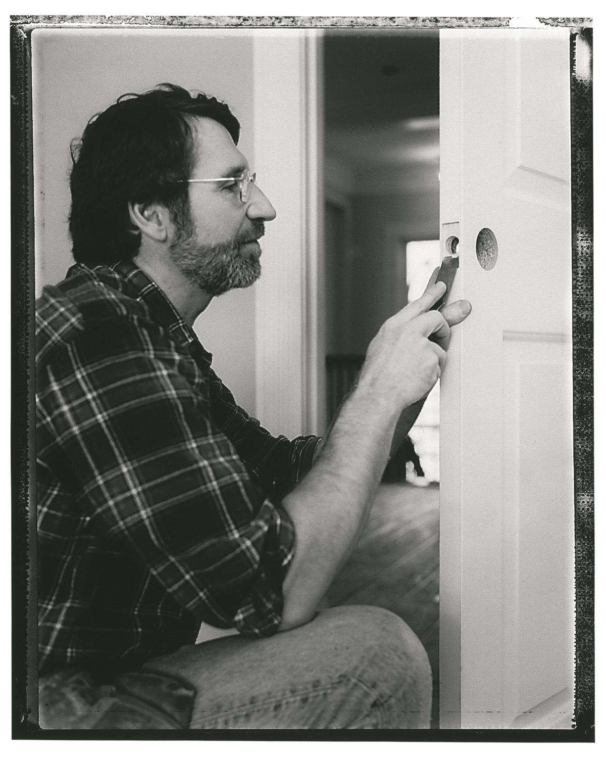 Norm Abram chiseling a door