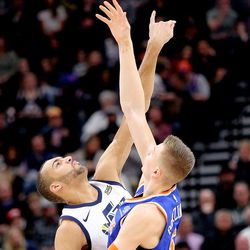Utah Jazz center Rudy Gobert (27) and New York Knicks forward Kristaps Porzingis (6) reach for the tip off during a basketball game at the Vivint Smart Home Arena in Salt Lake City on Friday, Jan. 19, 2018.