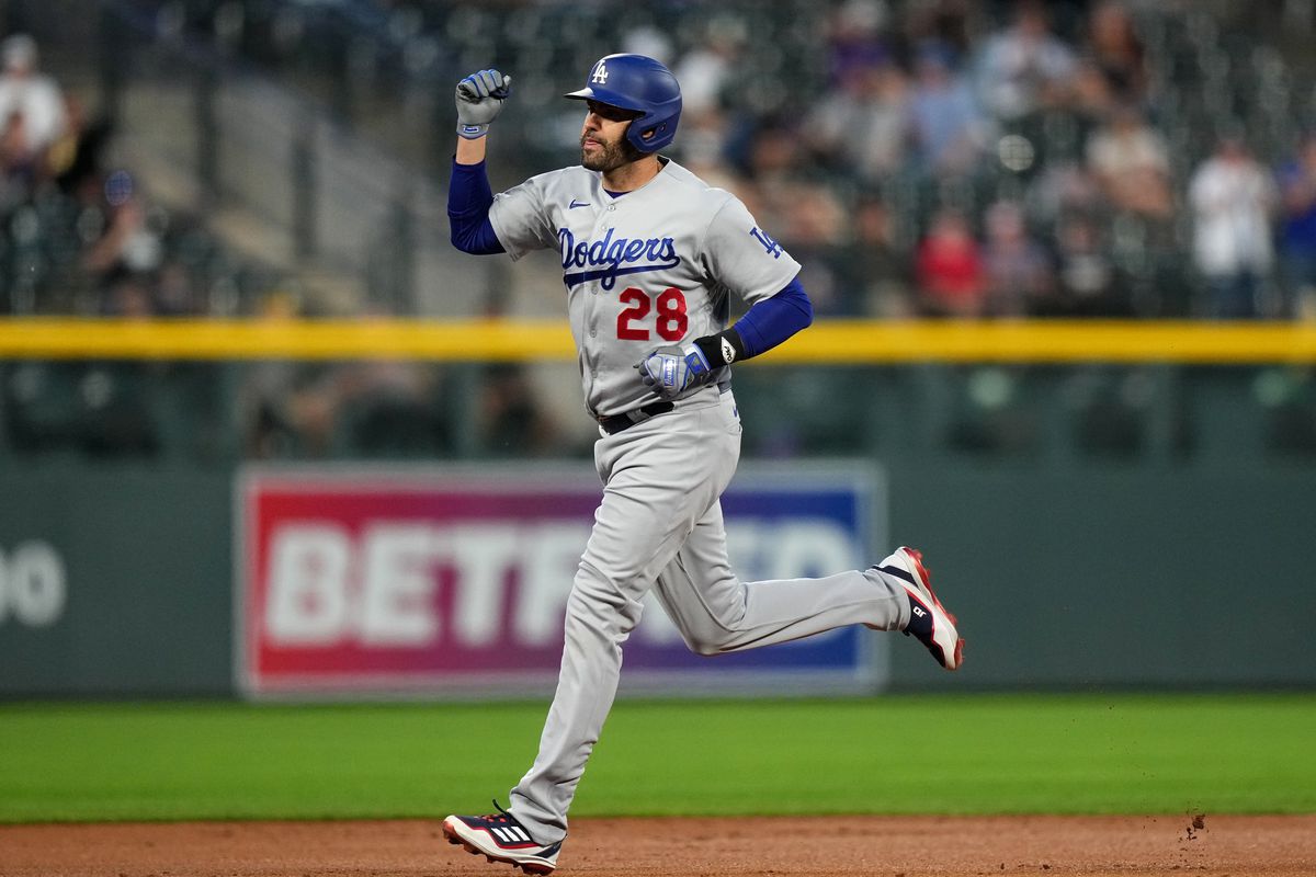 Los Angeles Dodgers designated hitter J.D. Martinez runs off his two run home run in the first inning against the Colorado Rockies at Coors Field.