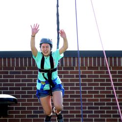 Emily Langie, of Salt Lake City, leaps for the bar during an activity on a ropes course outside the University of Utah Neuropsychiatric Institute in Salt Lake City on Wednesday, June 29, 2016. The Ulster Project’s mission is to help young, Christian-based potential leaders from Northern Ireland and the United States become peacemakers by providing a safe environment to learn and practice the skills needed to unite people when differences divide them. The Ulster Project of Utah has been bringing a dozen teens from Northern Ireland for a month each summer. Half the group comes from Catholic families and half from Protestant families.