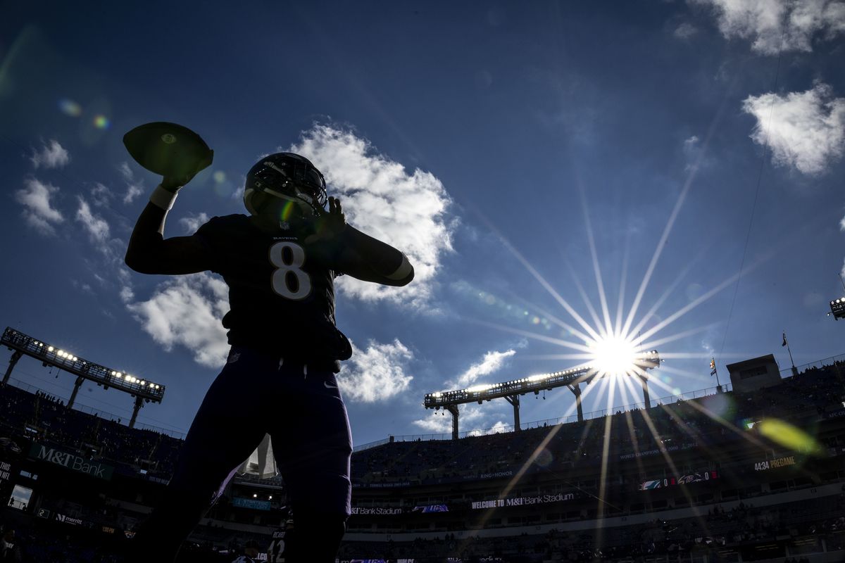 Lamar Jackson #8 of the Baltimore Ravens looks to pass as he warms up prior to an NFL football game between the Baltimore Ravens and the Miami Dolphins at M&amp;T Bank Stadium on December 31, 2023 in Baltimore, Maryland.