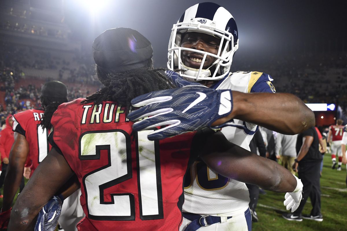 Los Angeles Rams LB Cory Littleton embraces Atlanta Falcons CB Desmond Trufant after the wild card playoff game