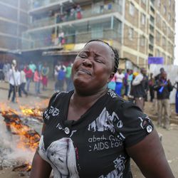 Residents of the Mathare area of Nairobi, Kenya, take to the streets by blocking roads with burning tyres to protest in support of Kenyan opposition leader and presidential candidate Raila Odinga, Wednesday Aug. 9, 2017.  Odinga alleges that hackers manipulated the Tuesday election results which appear to show President Uhuru Kenyatta has a wide lead over Odinga. (AP Photo. (AP Photo/Brian Inganga)
