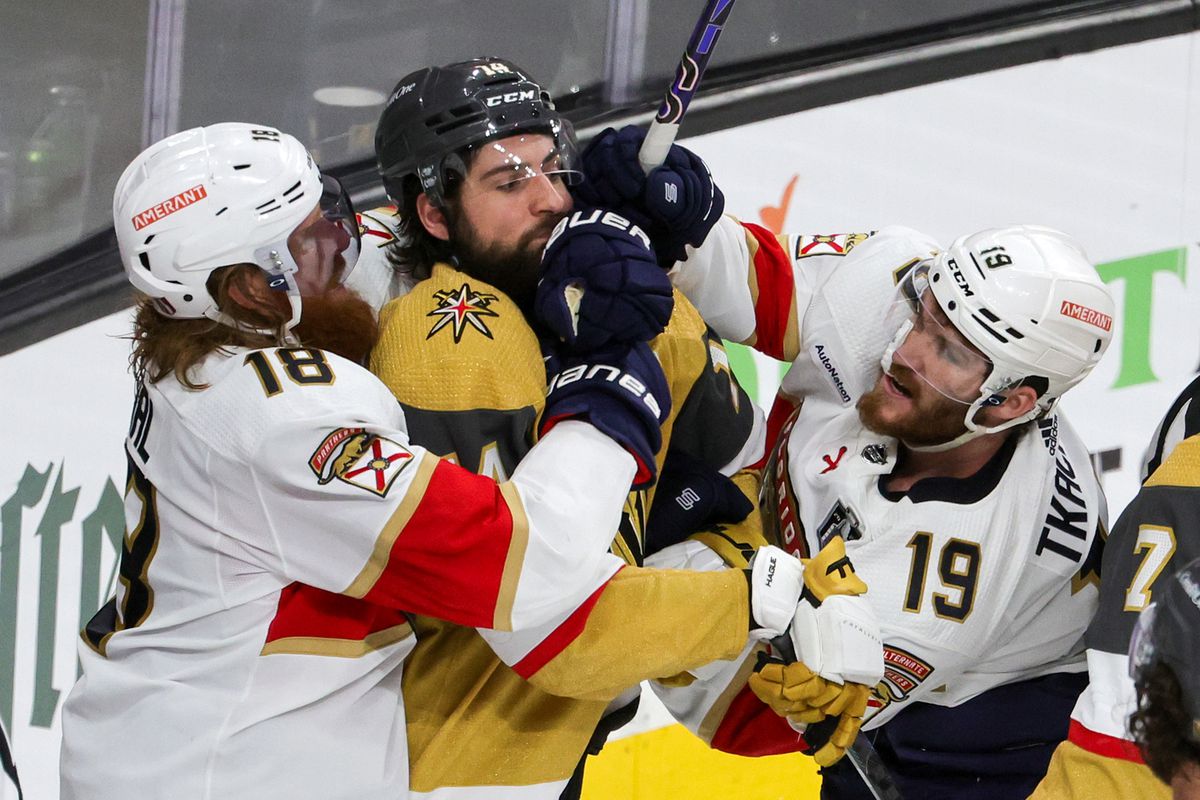 Marc Staal and Matthew Tkachuk of the Florida Panthers fight with Nicolas Hague of the Vegas Golden Knights in the third period of Game One of the 2023 NHL Stanley Cup Final at T-Mobile Arena on June 03, 2023 in Las Vegas, Nevada. The Golden Knights defeated the Panthers 5-2.