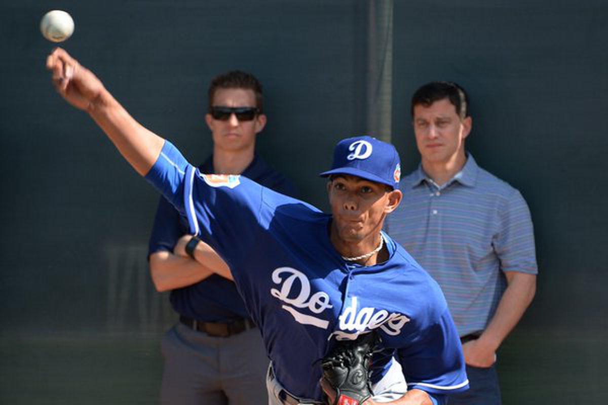 Andrew Friedman was among several watching Yaisel Sierra's first day in a Dodgers uniform.