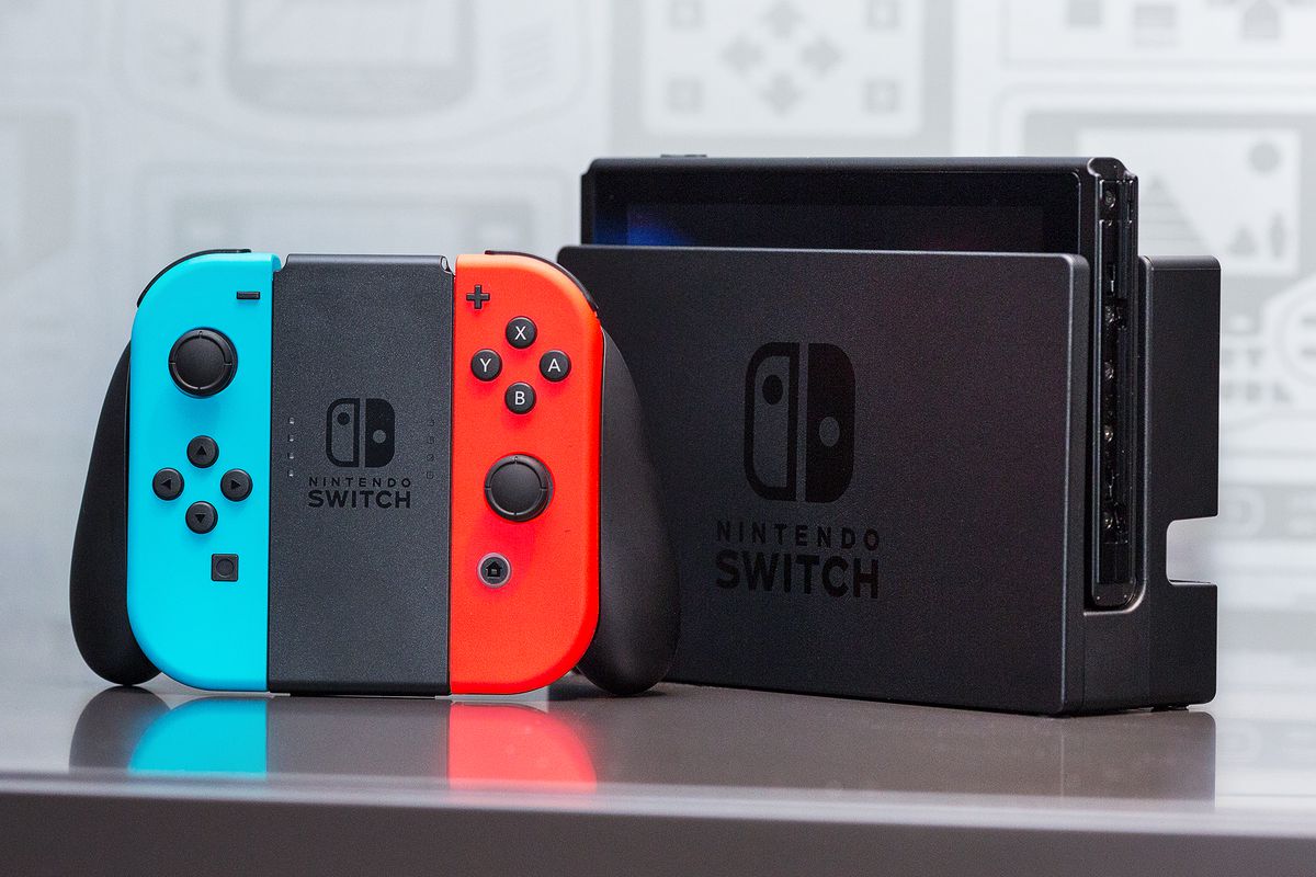 The Nintendo Switch in its dock, with the Joy-Con grip.