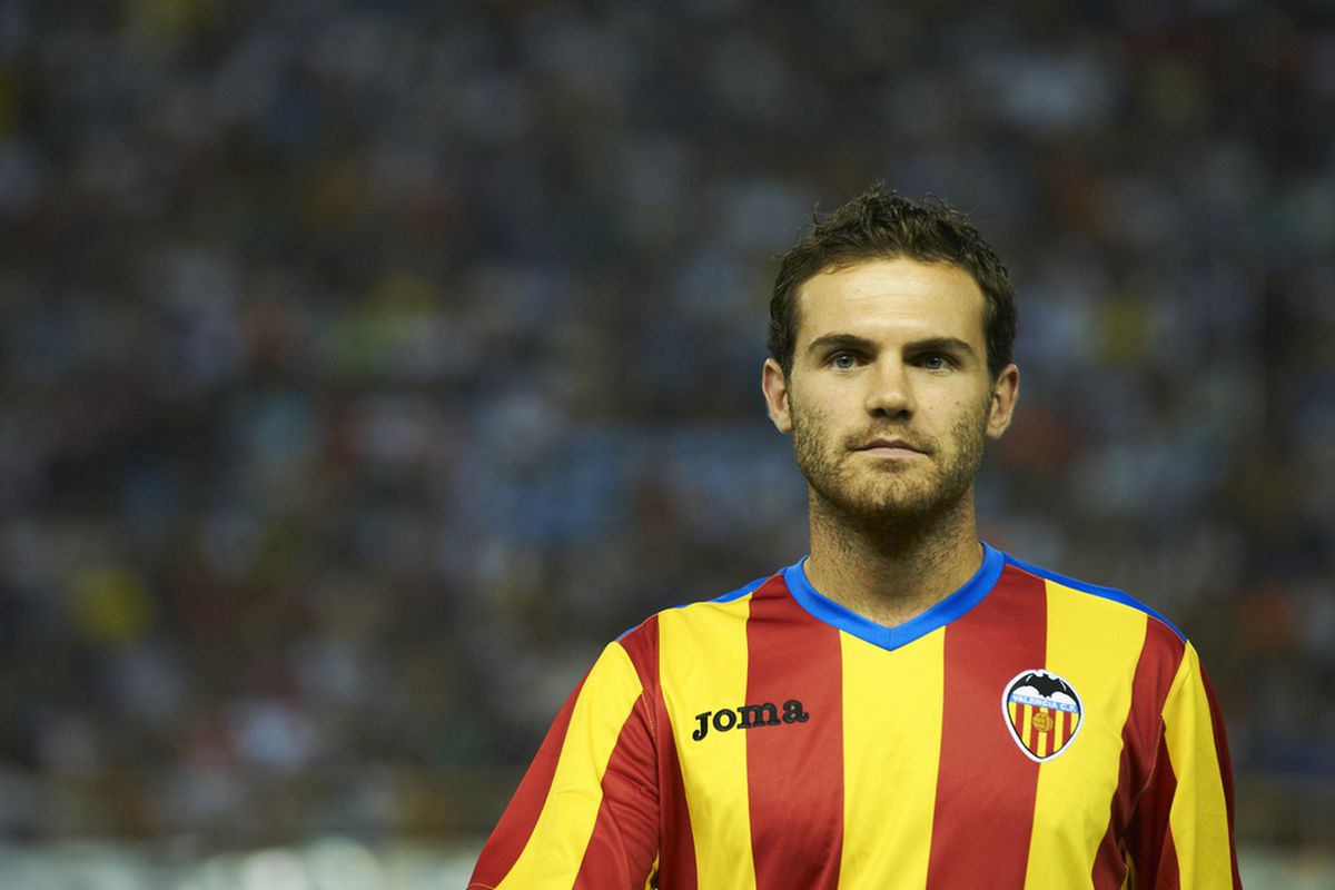 VALENCIA, SPAIN - AUGUST 12:  Juan Mata of Valencia looks on before the start of the Orange Trophy match between Valencia and Roma at Estadio Mestalla on August 12, 2011 in Valencia, Spain.  (Photo by Manuel Queimadelos Alonso/Getty Images)