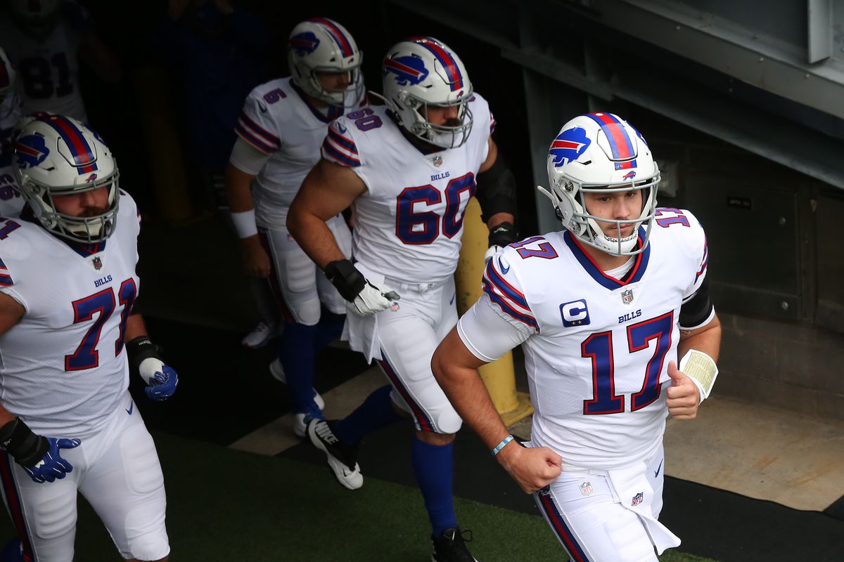 Quarterback Josh Allen #17 of the Buffalo Bills and teammates jog through the players tunnel onto the field for the game against the New York Jets at MetLife Stadium on October 25, 2020 in East Rutherford, New Jersey.