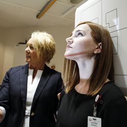 Laurie Falk, left, and Morgan Sidwell demonstrate the new Multitom Rax Twin Robotic X-ray System at University Hospital's radiology department in Salt Lake City on Friday, July 15, 2016. 
The new diagnostic technology will provide convenience and one-stop shopping for patients, as well as valuable 3-D imaging and research opportunities.