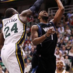Paul Millsap of the Utah Jazz defends Derrick Williams of the Minnesota Timberwolves during NBA basketball in Salt Lake City Friday, April 12, 2013.