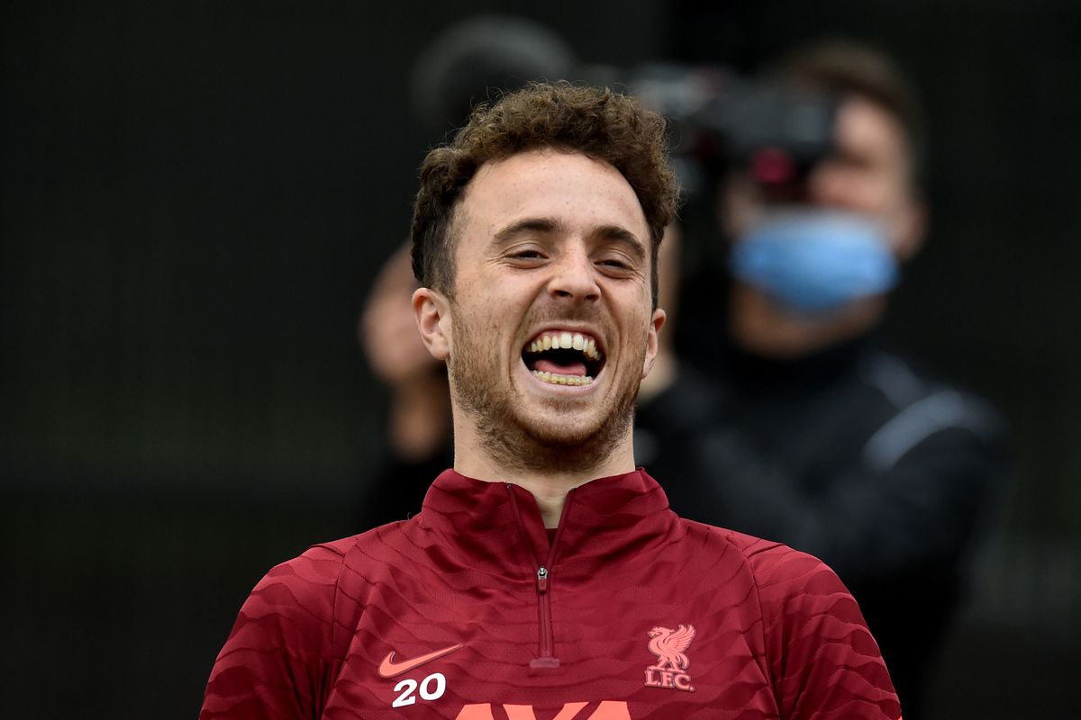Diogo Jota of Liverpool laughing during a training session at AXA Training Centre on September 09, 2021 in Kirkby, England.