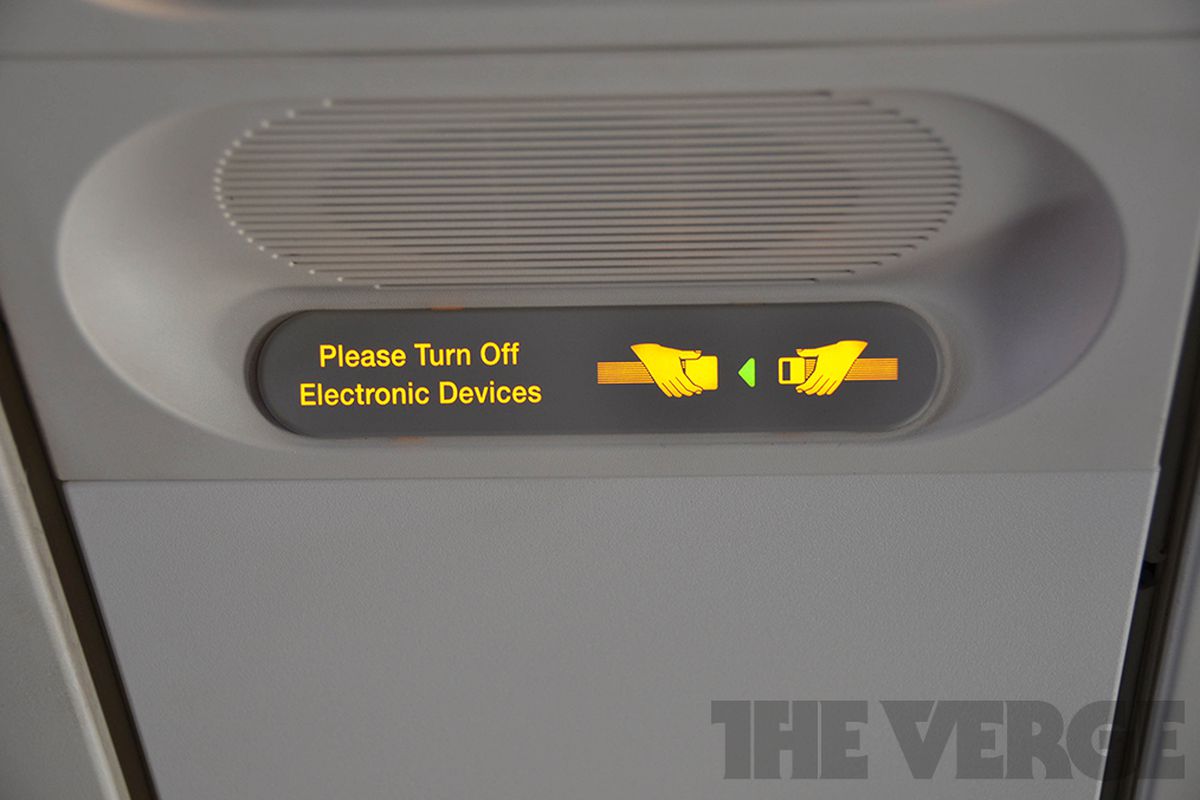 Please turn off electronic devices airplane stock (1020)
