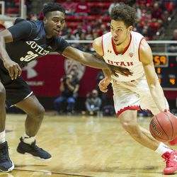 Utah guard Devon Daniels (3) drives to the hoop against Butler forward Kelan Martin (30) during an NCAA college basketball game at the Huntsman Center in Salt Lake City on Monday, Nov. 28, 2016. Butler took down Utah 68-59 to remain undefeated.