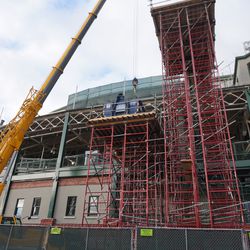 Scaffolding on the south side of the ballpark, with a crane to lift up dumpsters