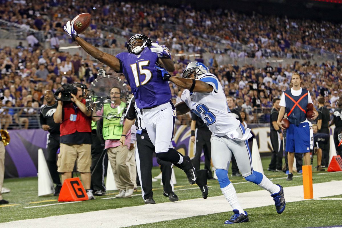 August 17, 2012; Baltimore, MD, USA; Baltimore Ravens wide receiver LaQuan Williams (15) cannot catch a pass while defended by Detroit Lions cornerback Chris Houston (23) at M&T Bank Stadium. Mandatory Credit: Mitch Stringer-US PRESSWIRE