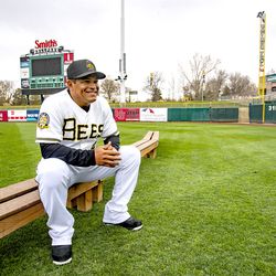 Bees' defensive coach Ray Olmedo sits on a bench prior to a team photo as the Salt Lake Bees hold their media day at Smith's Ballpark on Tuesday, April 2, 2019.