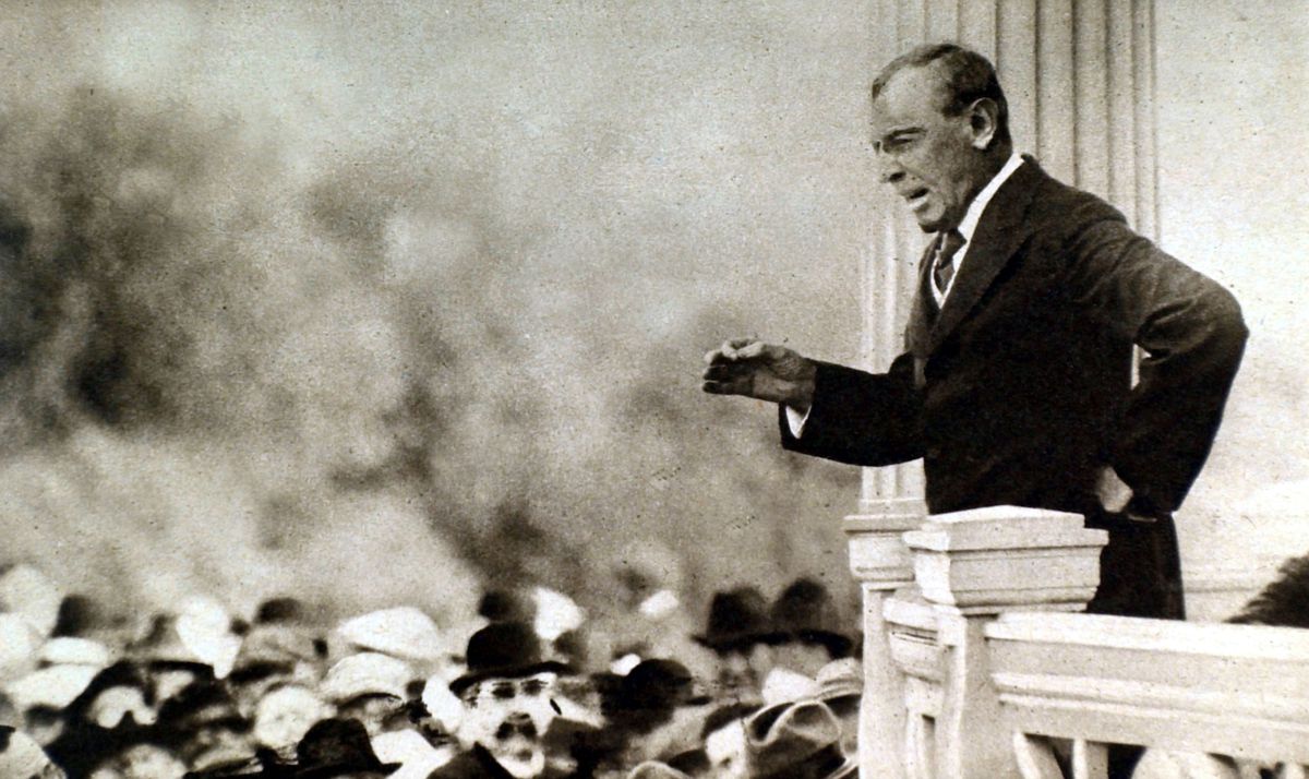 Woodrow Wilson standing on balcony