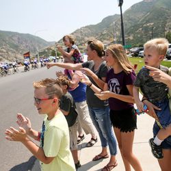 Spectators cheer as stage 5 of the Tour of Utah passes through Layton on Friday, Aug. 4, 2017.