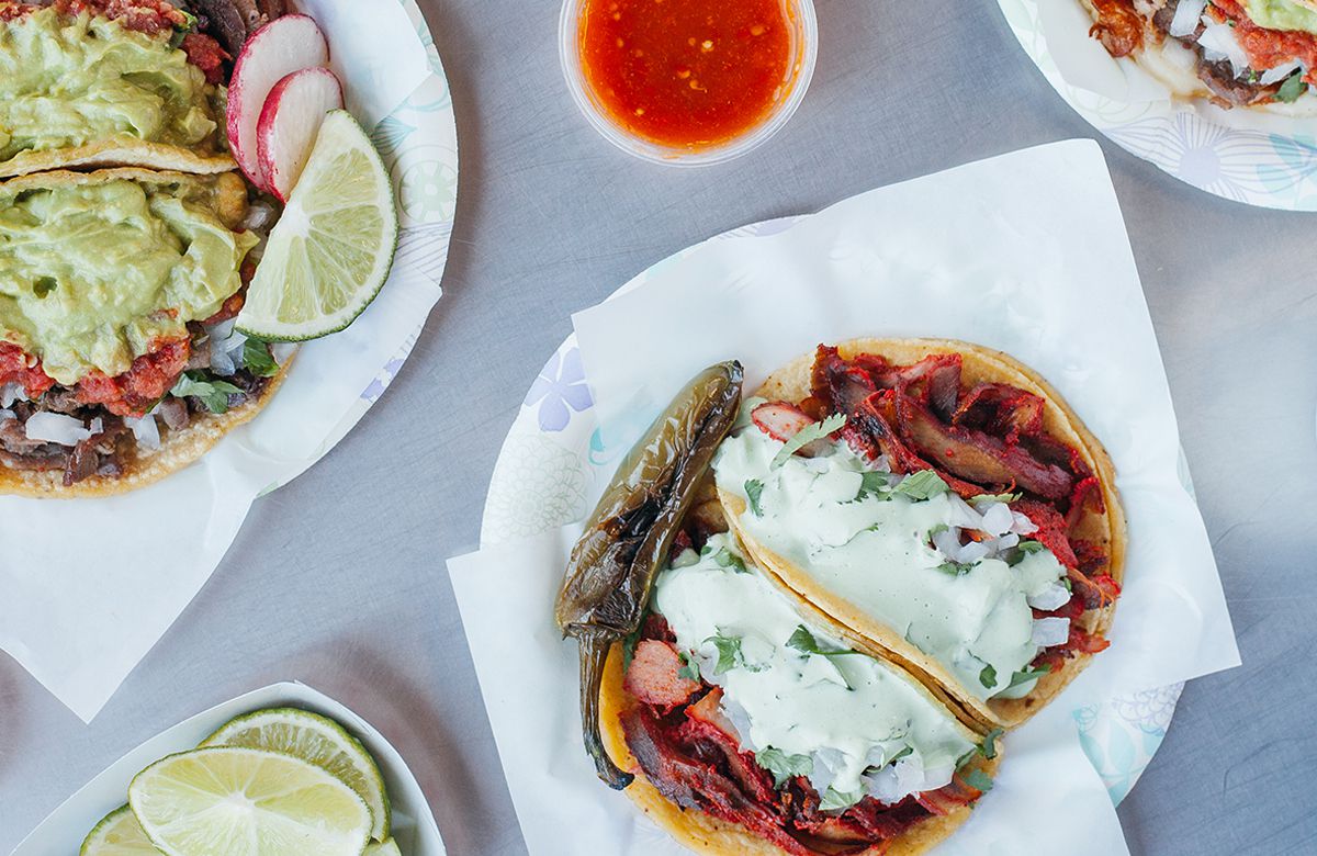An array of tacos and drinks at Tacos El Gordo