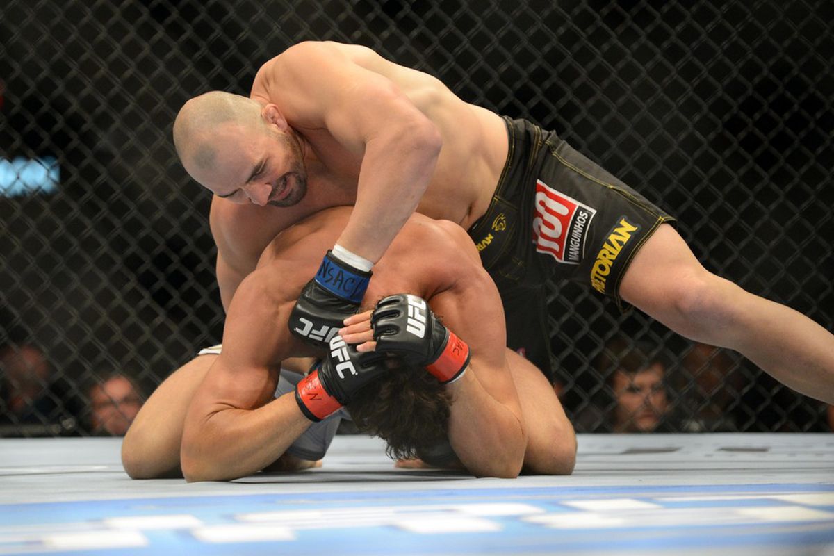 May 26, 2012; Las Vegas, NV, USA; Kyle Kingsbury (top) and Glover Teixeira (bottom) fight during UFC 146 at the MGM Grand Garden event center. Mandatory Credit: Ron Chenoy-US PRESSWIRE
