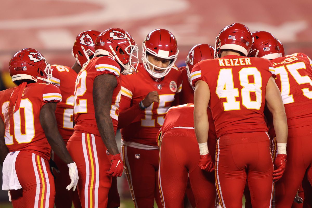 Patrick Mahomes #15 of the Kansas City Chiefs stands in the huddle during the second quarter of a game against the Denver Broncos at Arrowhead Stadium on December 06, 2020 in Kansas City, Missouri.