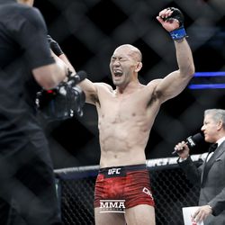 Yushin Okami celebrates his UFC on FOX 29 win.