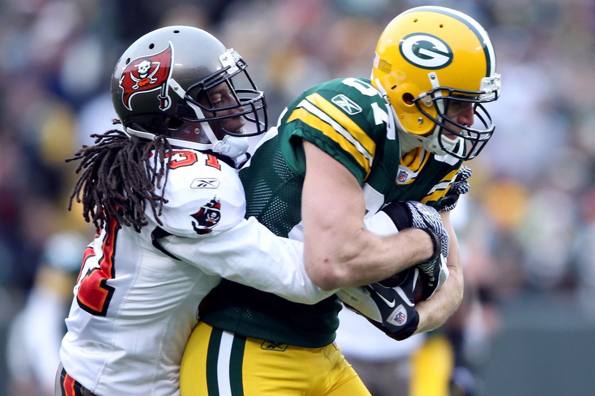 GREEN BAY, WI - NOVEMBER 20:   E.J. Biggers #31 of the Tampa Bay Buccaneers tackles  Jordy Nelson #87 of the Green Bay Packers on November 20,2011 at Lambeau Field in Green Bay, Wisconsin.  (Photo by Elsa/Getty Images)