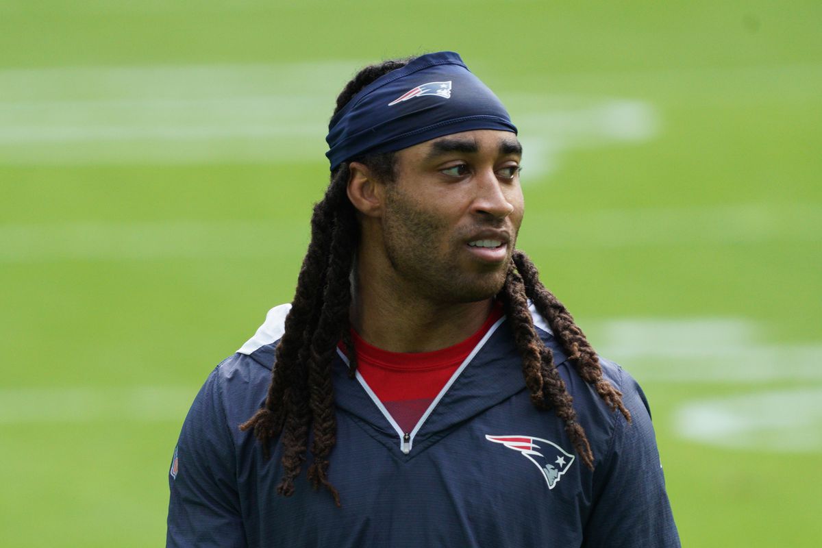 Stephon Gilmore #24 of the New England Patriots looks on prior to the game against the Miami Dolphins at Hard Rock Stadium on December 20, 2020 in Miami Gardens, Florida.