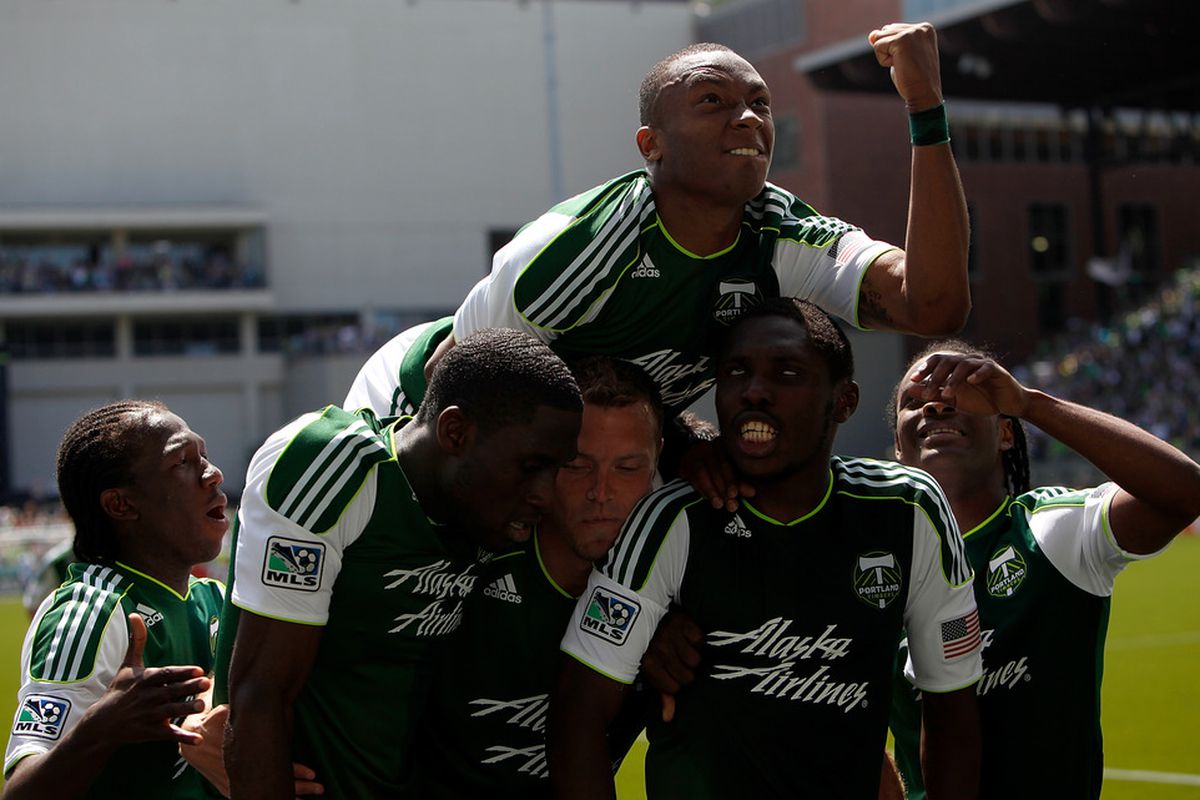 PORTLAND, OR - JULY 10:  Portland Timbers players celebrate the own goal by Jeff Parke #31  of the Seattle Sounderson July 2, 2011 at Jeld-Wen Field in Portland, Oregon.  (Photo by Jonathan Ferrey/Getty Images)