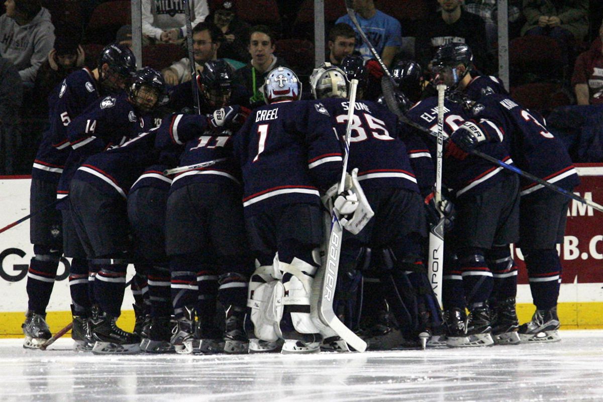 UConn men's hockey huddles up before their game with the UMass Minutemen at the Mullins Center in Amherst, MA on December 1, 2017.