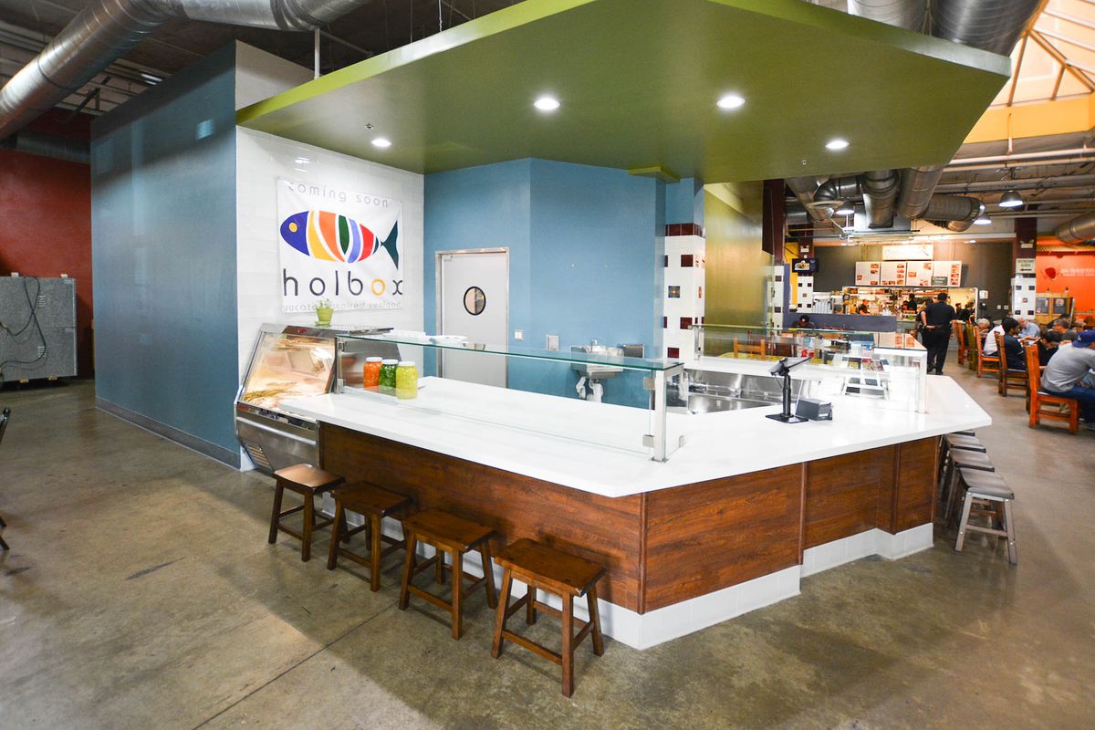A food preparation counter area with seating at Holbox restaurant in Downtown Los Angeles, California.