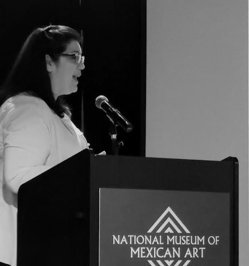 Hellen Antonopoulos speaking at the National Museum of Mexican Art.