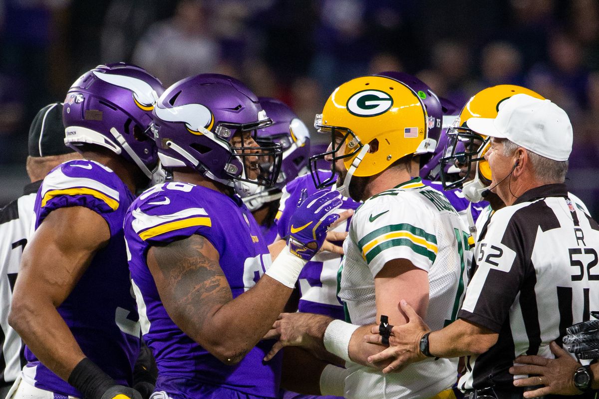Green Bay Packers QB Aaron Rodgers and Minnesota Vikings DE Everson Griffen talk after a play in the second quarter in Week 12, Nov. 25, 2018.