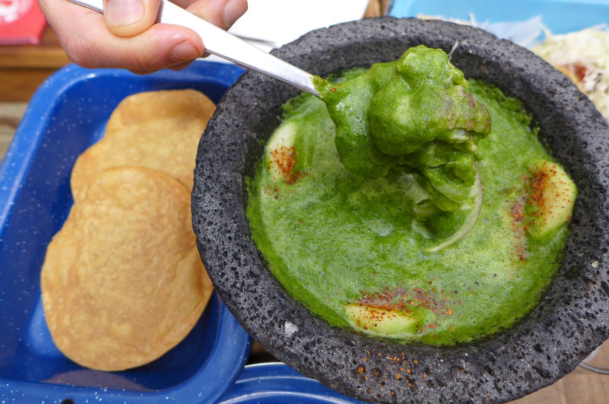 A green soup in a lava stone bowl.