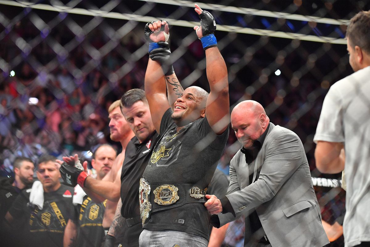 Daniel Cormier gets the UFC heavyweight belt wrapped around his waist at UFC 226. 
