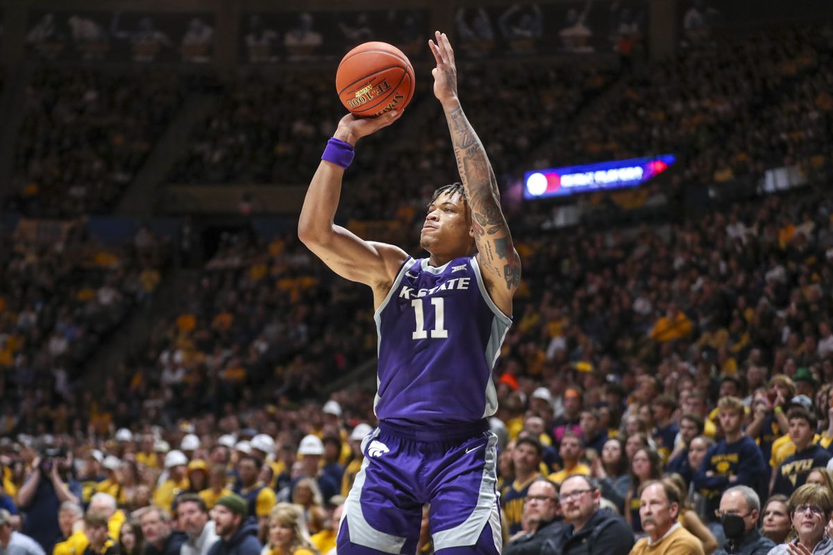 Kansas State Wildcats forward Keyontae Johnson (11) shoots a three point basket during the first half against the West Virginia Mountaineers at WVU Coliseum.