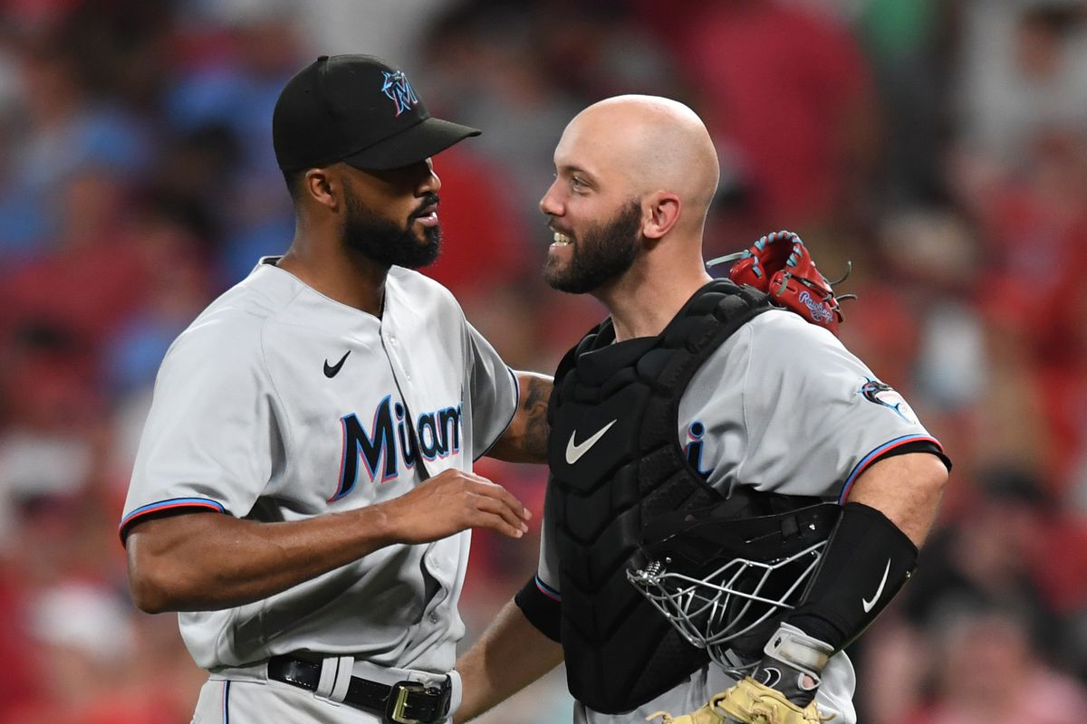 Sandy Alcantara #22 and Jacob Stallings #58 of the Miami Marlins celebrate after defeating the St. Louis Cardinals 4-3 at Busch Stadium on June 29, 2022 in St Louis, Missouri.
