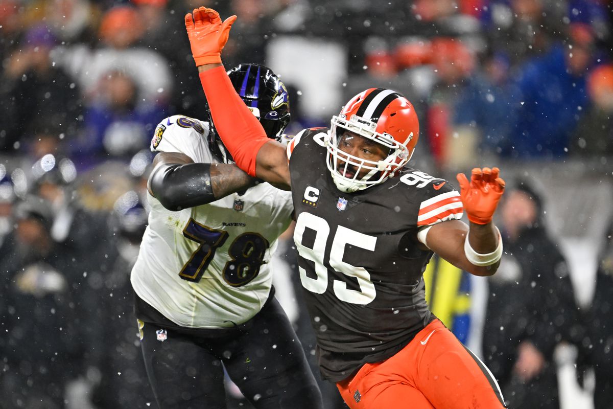 Myles Garrett #95 of the Cleveland Browns is blocked by Morgan Moses #78 of the Baltimore Ravens during the fourth quarter at FirstEnergy Stadium on December 17, 2022 in Cleveland, Ohio.