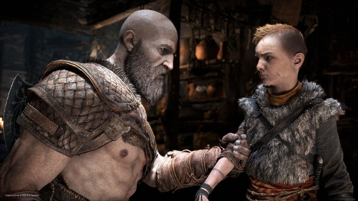 Kratos grabs Atreus by the arm in God of War (2018)